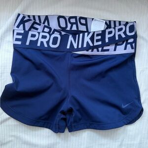 Navy blue high waisted Nike pros.